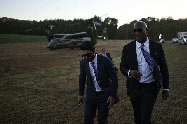 US former professional boxer Evander Holyfield walks towards T. Ed Garrison Arena in Pendleton, South Carolina on October 21, 2026 to attend a midterm campaign rally with US President Donald Trump. (Photo by Kent NISHIMURA / AFP)