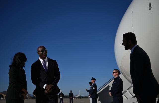 Former professional boxer Evander Holyfield waits on the tarmac after disembarking from Air Force One upon arrival at Greenville-Spartanburg International Airport in Greer, South Carolina on October 21, 2026. (Photo by Kent NISHIMURA / AFP)