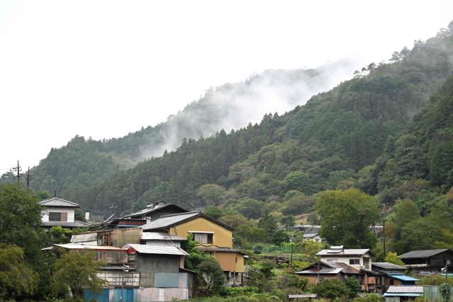 A general view of Nanmoku village, Gunma prefecture is seen on September 26, 2026. In a misty mountain village in Japan, residents recently welcomed unlikely guests from a Peruvian district along the Amazon River, seeing a chance to revive an ageing community facing extinction. Nanmoku village officials hope a sister-city agreement, which promotes cultural and people-to-people ties, will ultimately attract young people from Belen to live in Nanmoku, although how they might obtain residency remains unclear. (Photo by Rie KIKUCHI / AFP) / To go with AFP story Japan-Peru-social-population-demographics, FOCUS by Natsuko Fukue and Junior Raborg