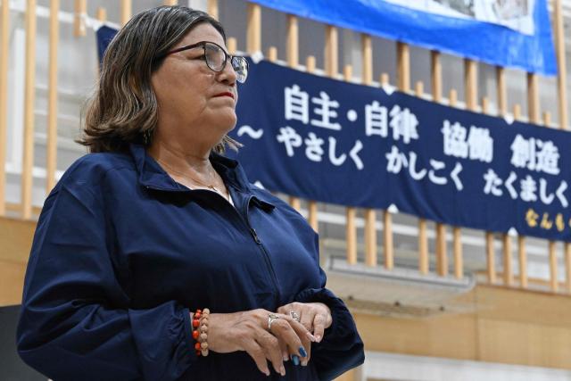 Belen mayor Lina Arista Lopez, a guest from Peru's Belen district, visits a primary school in Nanmoku village, Japan's Gunma prefecture on September 26, 2026. In a misty mountain village in Japan, residents recently welcomed unlikely guests from a Peruvian district along the Amazon River, seeing a chance to revive an ageing community facing extinction. Nanmoku village officials hope a sister-city agreement, which promotes cultural and people-to-people ties, will ultimately attract young people from Belen to live in Nanmoku, although how they might obtain residency remains unclear. (Photo by Rie KIKUCHI / AFP) / To go with AFP story Japan-Peru-social-population-demographics, FOCUS by Natsuko Fukue and Junior Raborg