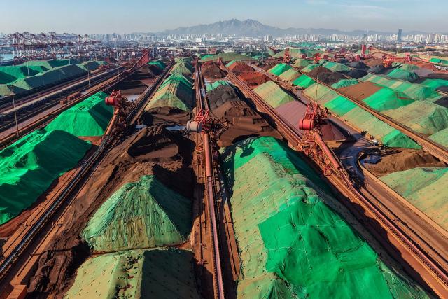 A general view shows an iron ore terminal at a port in Qingdao, in China’s eastern Shandong province on October 22, 2026. (Photo by CN-STR / AFP) / China OUT