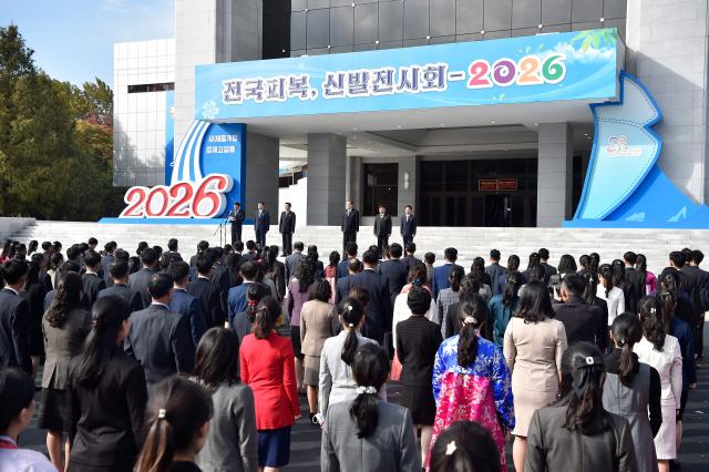 People participate in the opening ceremony of the National Garment and Footwear Exhibition at the Three-Revolution Exhibition House in Pyongyang on October 21, 2026. (Photo by KIM Won Jin / AFP)