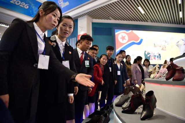 People look around the National Garment and Footwear Exhibition at the Three-Revolution Exhibition House in Pyongyang on October 21, 2026. (Photo by KIM Won Jin / AFP)