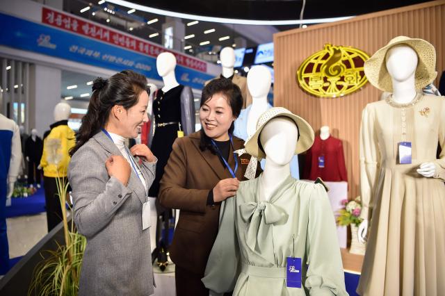 People look around the National Garment and Footwear Exhibition at the Three-Revolution Exhibition House in Pyongyang on October 21, 2026. (Photo by KIM Won Jin / AFP)