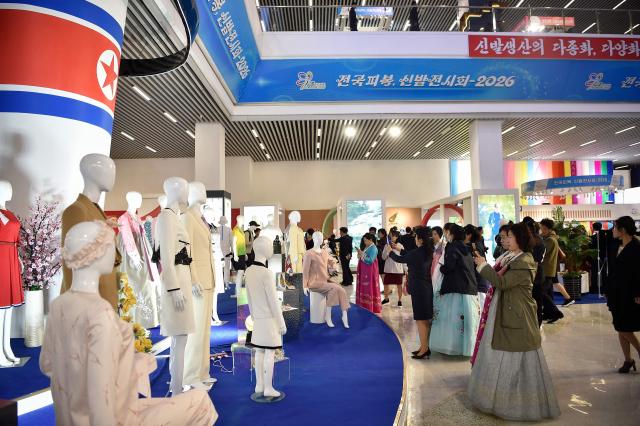 People look around the National Garment and Footwear Exhibition at the Three-Revolution Exhibition House in Pyongyang on October 21, 2026. (Photo by KIM Won Jin / AFP)