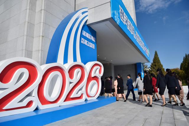 People participate in the opening ceremony of the National Garment and Footwear Exhibition at the Three-Revolution Exhibition House in Pyongyang on October 21, 2026. (Photo by KIM Won Jin / AFP)