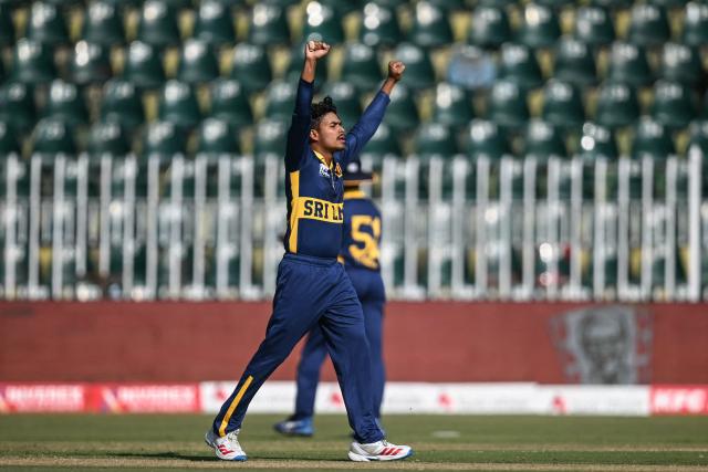 Sri Lanka's Dunith Wellalage celebrates after taking the wicket of England's Tom Banton during the one-day international (ODI) tri-series cricket match between England and Sri Lanka at the Rawalpindi Cricket Stadium in Rawalpindi on October 22, 2026. (Photo by FAROOQ NAEEM / AFP)