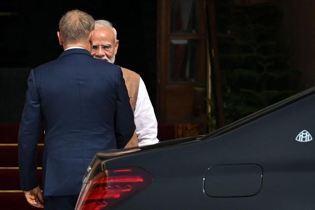 India's Prime Minister Narendra Modi (back) receives Poland's Prime Minister Donald Tusk ahead of their meeting at the Hyderabad House in New Delhi on October 22, 2026. (Photo by Arun SANKAR / AFP)