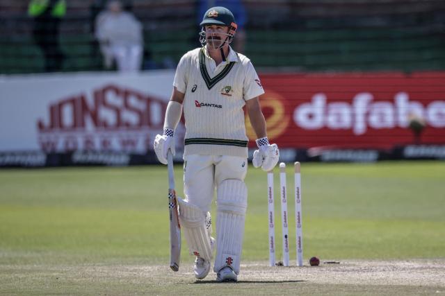 Australia's Travis Head walks back to the pavilion after being bowled by South Africa's Wiaan Mulder on day five of the second Test match between South Africa and Australia at St Georges Park in Gqeberha on October 22, 2026. Australia were made to follow on after being dismissed for just 99 in reply to South Africa's first innings total of 425 for nine declared, a deficit of 326 runs, on day four at Gqeberha. (Photo by Marco Longari / AFP)