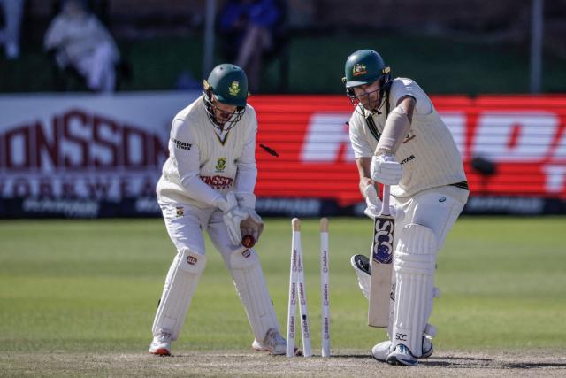 TOPSHOT - Australia's Scott Boland is bowled by South Africa's Wiaan Mulder on day five of the second Test match between South Africa and Australia at St Georges Park in Gqeberha on October 22, 2026. Australia were made to follow on after being dismissed for just 99 in reply to South Africa's first innings total of 425 for nine declared, a deficit of 326 runs, on day four at Gqeberha. (Photo by Marco Longari / AFP)
