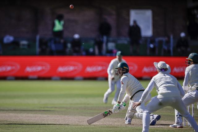 Australia's Alex Carey watches the ball after playing a shot on day five of the second Test match between South Africa and Australia at St Georges Park in Gqeberha on October 22, 2026. Australia were made to follow on after being dismissed for just 99 in reply to South Africa's first innings total of 425 for nine declared, a deficit of 326 runs, on day four at Gqeberha. (Photo by Marco Longari / AFP)