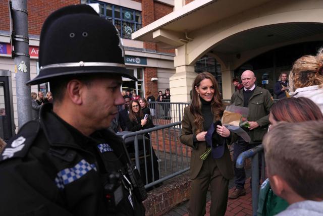 Britain's Catherine, Princess of Wales, greets well-wishers as she leaves after visiting Cafe 98 inside East Anglia's Children's Hospices' (EACH) shop in Hoveton, eastern England on October 22, 2026. Cafe 98, run by East Anglia's Children's Hospices (EACH), is the charity's first and only cafe, forming part of EACH's fundraising operation and serving as a community hub for local residents. (Photo by Ben Stansall / POOL / AFP)