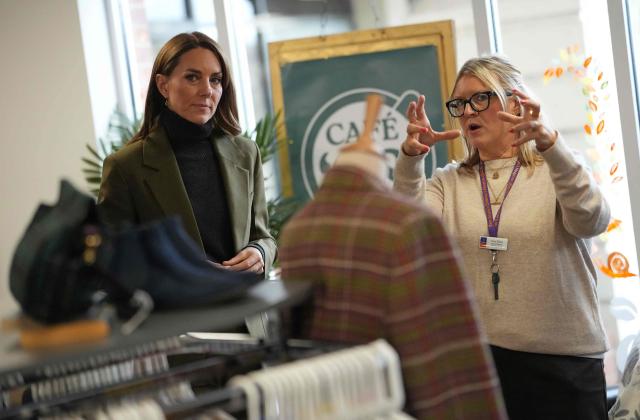 Britain's Catherine, Princess of Wales, talks with shop manager Fran during a visit to Café 98 inside East Anglia's Children's Hospices (EACH) shop in Hoveton, eastern England on October 22, 2026. Cafe 98, run by East Anglia's Children's Hospices (EACH), is the charity's first and only cafe, forming part of EACH's fundraising operation and serving as a community hub for local residents. (Photo by Ben Stansall / POOL / AFP)