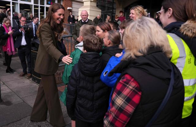 Britain's Catherine, Princess of Wales, greets well-wishers as she leaves after visiting Cafe 98 inside East Anglia's Children's Hospices' (EACH) shop in Hoveton, eastern England on October 22, 2026. Cafe 98, run by East Anglia's Children's Hospices (EACH), is the charity's first and only cafe, forming part of EACH's fundraising operation and serving as a community hub for local residents. (Photo by Ben Stansall / POOL / AFP)