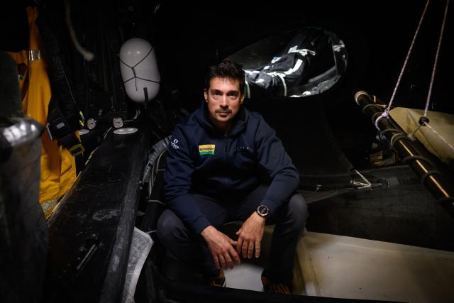 French skipper Davy Beaudart poses aboard his Imoca monohull 'Bureau Vallee' at the village of the Route du Rhum, in Saint-Malo, western France on October 22, 2026, a few days prior to the start of the 13th Route du Rhum - Destination Guadeloupe. From Saint-Malo in Brittany to Pointe-a-Pitre in Guadeloupe, over 100 skippers across 6 classes will take the start on November 1, 2026, in this solo transatlantic sailing race. (Photo by Loic VENANCE / AFP)
