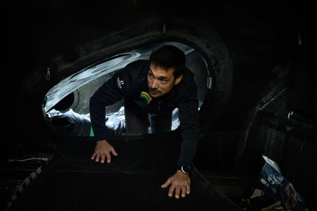 French skipper Davy Beaudart poses aboard his Imoca monohull 'Bureau Vallee' at the village of the Route du Rhum, in Saint-Malo, western France on October 22, 2026, a few days prior to the start of the 13th Route du Rhum - Destination Guadeloupe. From Saint-Malo in Brittany to Pointe-a-Pitre in Guadeloupe, over 100 skippers across 6 classes will take the start on November 1, 2026, in this solo transatlantic sailing race. (Photo by Loic VENANCE / AFP)