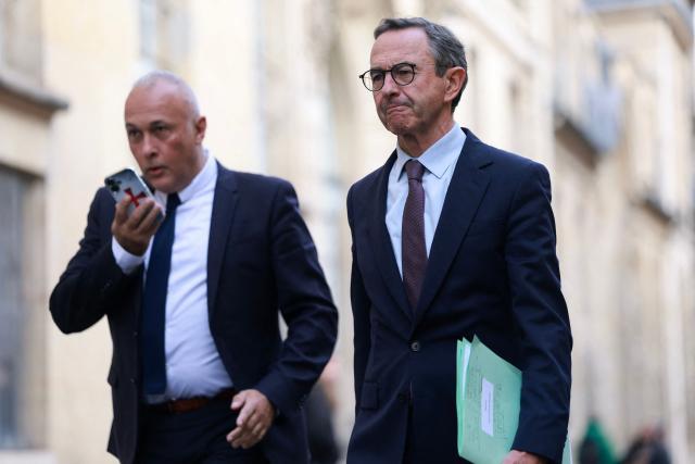 French right wing party Les Republicains (LR) candidate in France's 2027 presidential election Bruno Retailleau leaves after attending a meeting with French Prime minister bringing together party leaders, the chairs of the parliamentary groups in both houses and the chairs of the Legal Affairs Committees, along with the Ministers for the Interior and Justice, and senior officials from the police, the gendarmerie and the intelligence services, as France braced for more demonstrations just days after student and other rallies degenerated into some of the worst street unrest in years, outside the Hotel Matignon in Paris on October 22, 2026. (Photo by Kenzo TRIBOUILLARD / AFP)