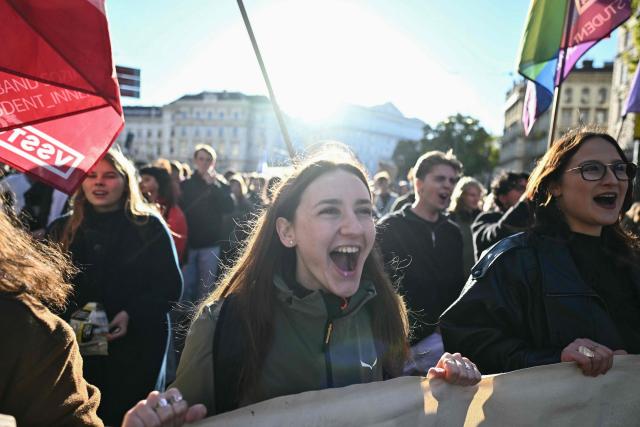 Protesters take part in a demonstration against university budget cuts outside the Technical University in Vienna, Austria, on October 22, 2026. (Photo by Joe Klamar / AFP)