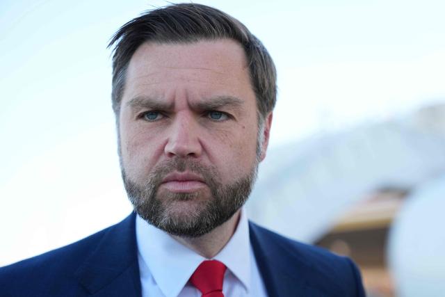 US Vice President JD Vance speaks to reporters before boarding Air Force Two at Cincinnati/Northern Kentucky International Airport in Hebron, Kentucky, on October 22, 2026. Vance is travelling to Nebraska for a midterm campaign rally. (Photo by Jacquelyn Martin / POOL / AFP)