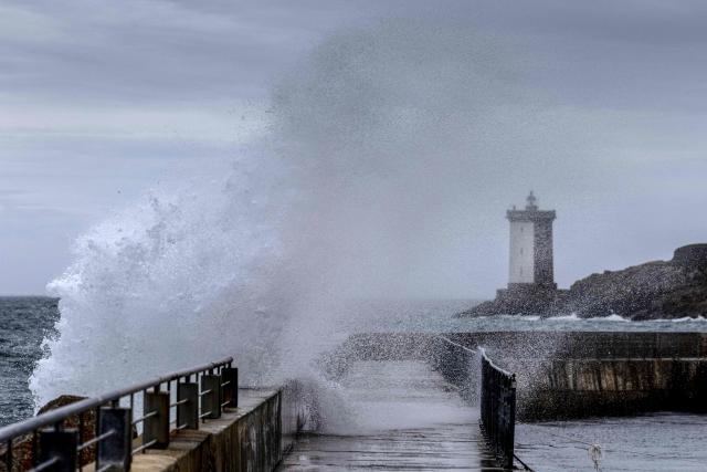 This photograph shows waves crashing on the jetty in the port of Le Conquet, western France, October 22, 2026, as storm Austen approches the coasts of France. (Photo by Fred TANNEAU / AFP)