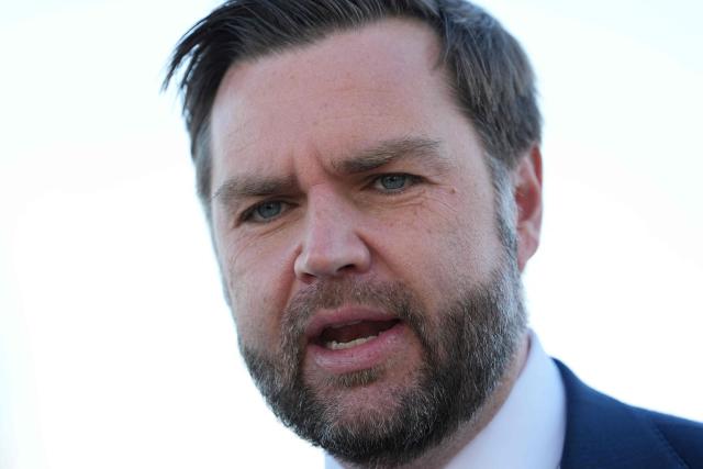 US Vice President JD Vance speaks to reporters before boarding Air Force Two at Cincinnati/Northern Kentucky International Airport in Hebron, Kentucky, on October 22, 2026. Vance is travelling to Nebraska for a midterm campaign rally. (Photo by Jacquelyn Martin / POOL / AFP)