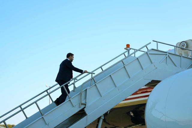 US Vice President JD Vance boards Air Force Two at Cincinnati/Northern Kentucky International Airport in Hebron, Kentucky, on October 22, 2026. Vance is travelling to Nebraska for a midterm campaign rally. (Photo by Jacquelyn Martin / POOL / AFP)