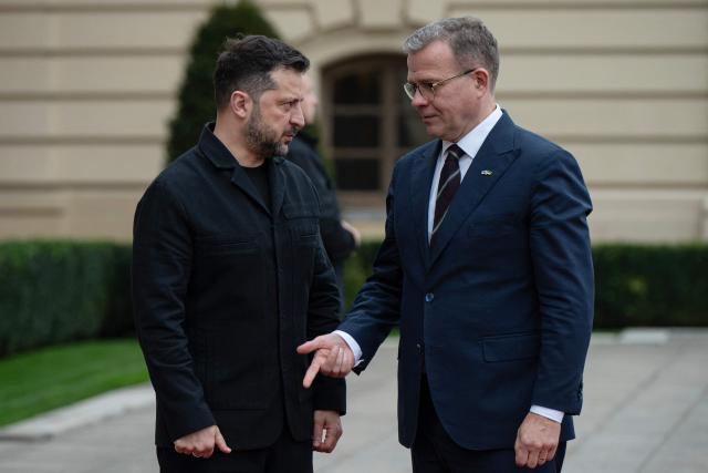 President of Ukraine Volodymyr Zelensky (L) welcomes Prime Minister of Finland Petteri Orpo during their meeting in Kyiv on October 22, 2026, amid the Russian invasion of Ukraine. (Photo by Genya SAVILOV / AFP)