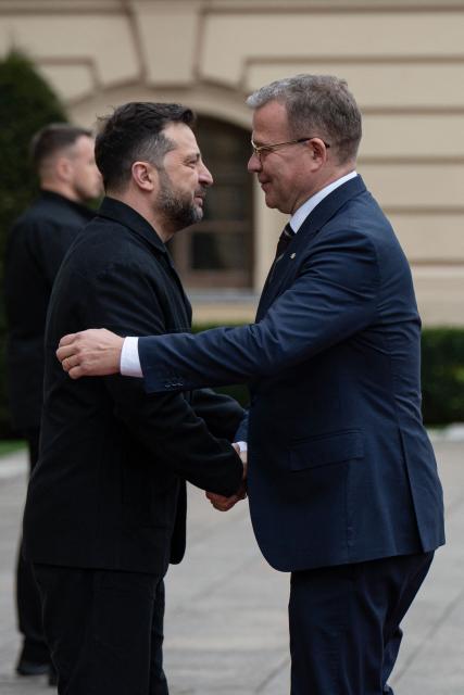 President of Ukraine Volodymyr Zelensky (L) welcomes Prime Minister of Finland Petteri Orpo during their meeting in Kyiv on October 22, 2026, amid the Russian invasion of Ukraine. (Photo by Genya SAVILOV / AFP)