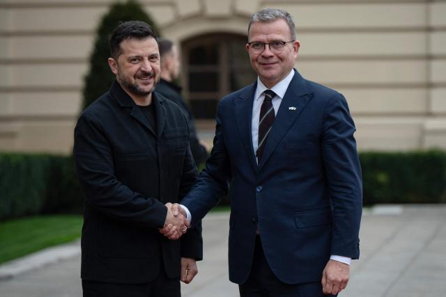 President of Ukraine Volodymyr Zelensky (L) welcomes Prime Minister of Finland Petteri Orpo during their meeting in Kyiv on October 22, 2026, amid the Russian invasion of Ukraine. (Photo by Genya SAVILOV / AFP)