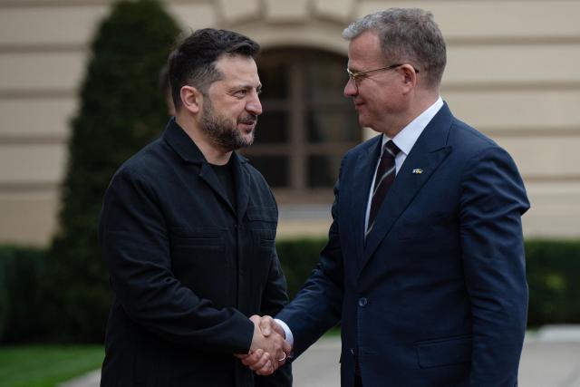 President of Ukraine Volodymyr Zelensky (L) welcomes Prime Minister of Finland Petteri Orpo during their meeting in Kyiv on October 22, 2026, amid the Russian invasion of Ukraine. (Photo by Genya SAVILOV / AFP)