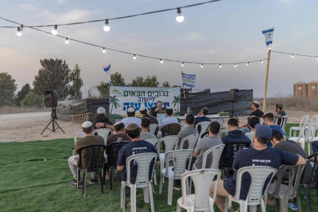Israeli right-wing members of the Nachala settler organisation attend a Torah lecture at a newly built camp site at a field near the Israeli Kibbutz of Nahal Oz in southern Israel, by the Israel-Gaza border on October 22, 2026. (Photo by Ilia YEFIMOVICH / AFP)