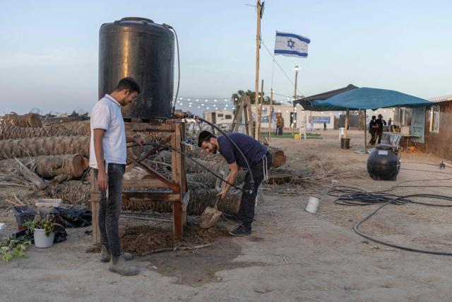 Israeli right-wing members of the Nachala settler organisation are seen at a newly built camp site at a field near the Israeli Kibbutz of Nahal Oz in southern Israel, by the Israel-Gaza border on October 22, 2026. (Photo by Ilia YEFIMOVICH / AFP)