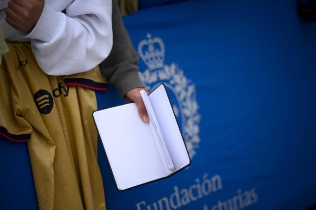 Fans wait for autographs of Lionel Messi prior an event with the Argentinian football legend at the sport hall in Oviedo on October 22, 2026. Lionel Messi will receive the 2026 Princess of Asturias Awards for Sport on October 23, 2026. (Photo by MIGUEL RIOPA / AFP)