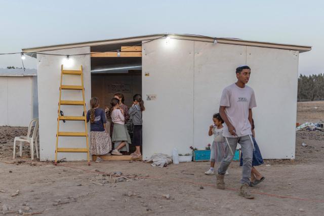 Children of Israeli right-wing members of the Nachala settler organisation are seen at a newly built camp site at a field near the Israeli Kibbutz of Nahal Oz in southern Israel, by the Israel-Gaza border on October 22, 2026. (Photo by Ilia YEFIMOVICH / AFP)