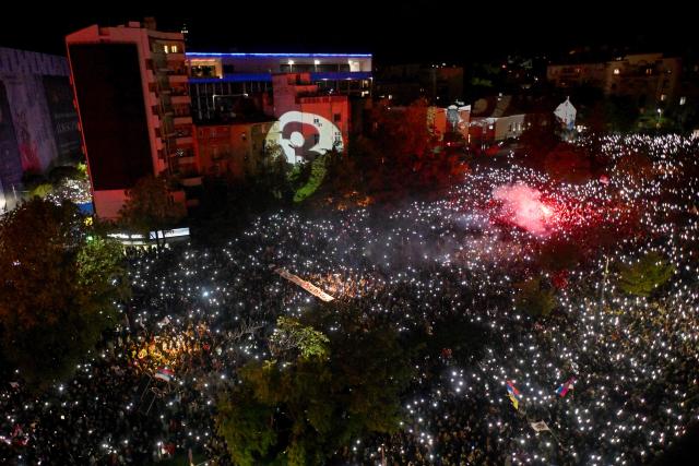 This general view shows supporters of Serbia's student-led movement as they attend the final campaign rally of the student-backed election list in central Belgrade on October 22, 2026, ahead of the country's snap parliamentary elections on October 25. The vote follows nearly two years of student-led protests sparked by the November 2024 collapse of a railway station canopy in Novi Sad that killed 16 people, with demands for early elections becoming a central goal of the movement. The student-backed list is challenging the ruling Serbian Progressive Party (SNS), led in the campaign by former president Aleksandar Vucic, who resigned in September to run for prime minister. (Photo by Sava Miric / AFP)