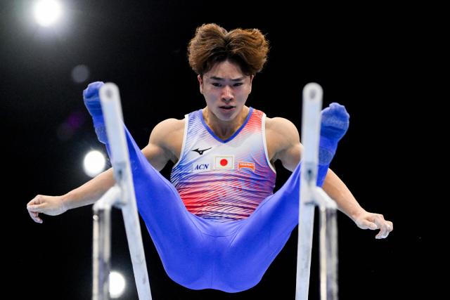 Japan's Shinnosuke Oka competes on the Parallel Bars in the Men's Individual All-Around Final during the 54th FIG Artistic Gymnastics World Championships, in Rotterdam, southern Netherlands, on October 22, 2026. (Photo by JOHN THYS / AFP)