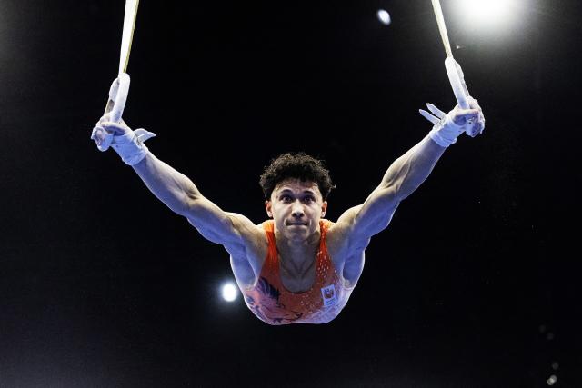 Netherlands's Jermain Gruenberg competes on the Rings in the Men's Individual All-Around Final during the 54th FIG Artistic Gymnastics World Championships, in Rotterdam, southern Netherlands, on October 22, 2026. (Photo by Iris van den Broek / ANP / AFP) / Netherlands OUT