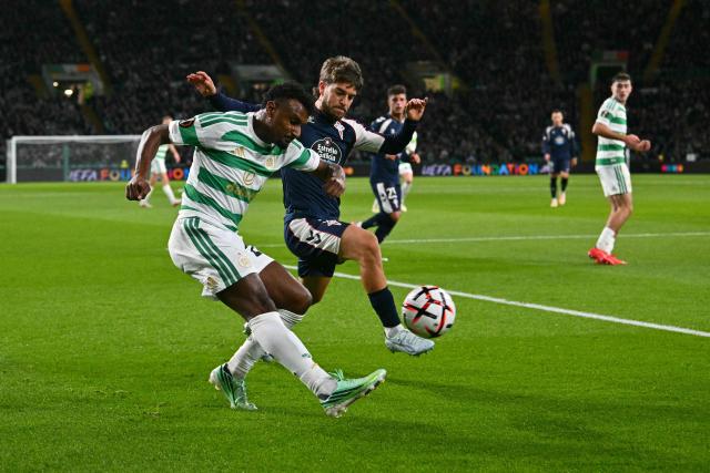 Celtic's Egyptian striker #23 Haissem Hassan battles for the ball with Celta Vigo's Spanish defender #05 Sergio Carreira  during the UEFA Europa League, League stage football match between Celtic and Celta Vigo at Celtic Park in Glasgow on October 22, 2026. (Photo by ANDY BUCHANAN / AFP)