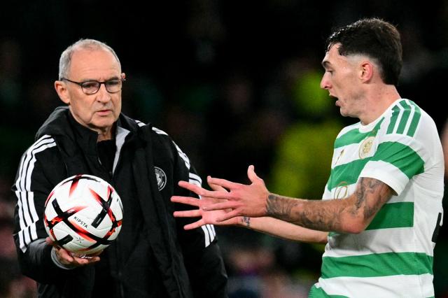 Celtic's Scottish defender #51 Colby Donovan takes the ball from Celtic's Northern Irish manager Martin O'Neill during the UEFA Europa League, League stage football match between Celtic and Celta Vigo at Celtic Park in Glasgow on October 22, 2026. (Photo by ANDY BUCHANAN / AFP)