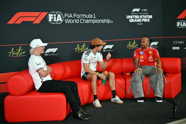 (L/R) Cadillac's Finnish driver Valtteri Bottas, Mercedes' Italian driver Kimi Antonelli and Ferrari's British driver Lewis Hamilton attend a press conference ahead of the United States Formula One Grand Prix at the Circuit of the Americas in Austin, Texas, on October 22, 2026. The United States Grand Prix will take place on Sunday, October 25. (Photo by ANGELA WEISS / AFP)