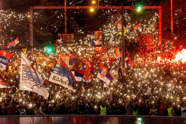 Supporters of Serbia's student-led movement attend the final campaign rally of the student-backed election list in central Belgrade on October 22, 2026, ahead of the country's snap parliamentary elections on October 25. The vote follows nearly two years of student-led protests sparked by the November 2024 collapse of a railway station canopy in Novi Sad that killed 16 people, with demands for early elections becoming a central goal of the movement. The student-backed list is challenging the ruling Serbian Progressive Party (SNS), led in the campaign by former president Aleksandar Vucic, who resigned in September to run for prime minister. (Photo by Mitar MITROVIC / AFP)