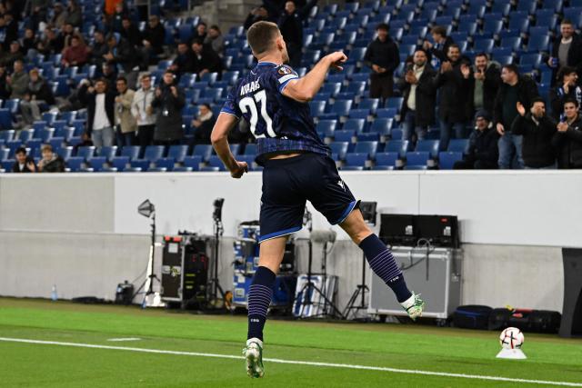 Hoffenheim's Croatian forward #27 Andrej Kramaric celebrates scoring his team's first goal during the UEFA Europa League  football match between Hoffenheim and Olympique Lyonnais in Sinsheim, southern Germany, on October 22, 2026. (Photo by THOMAS KIENZLE / AFP)