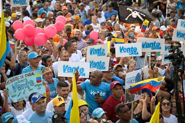 Supporters of Venezuelan opposition leader and Nobel Peace Prize winner Maria Corina Machado attend a rally to demand elections in Caracas on October 22, 2026. (Photo by Federico PARRA / AFP)