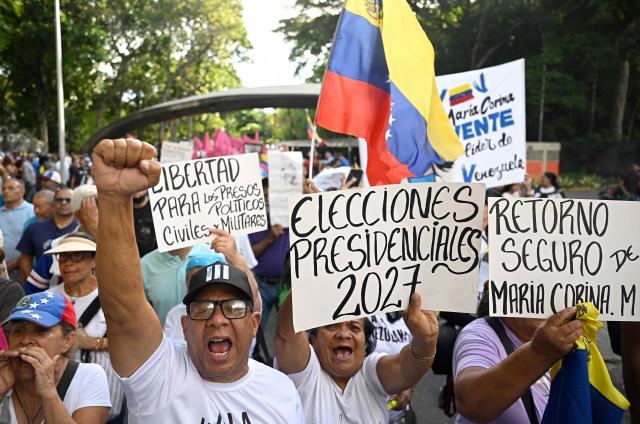Supporters of Venezuelan opposition leader and Nobel Peace Prize winner Maria Corina Machado shout slogans during a rally to demand elections in Caracas on October 22, 2026. (Photo by Federico PARRA / AFP)