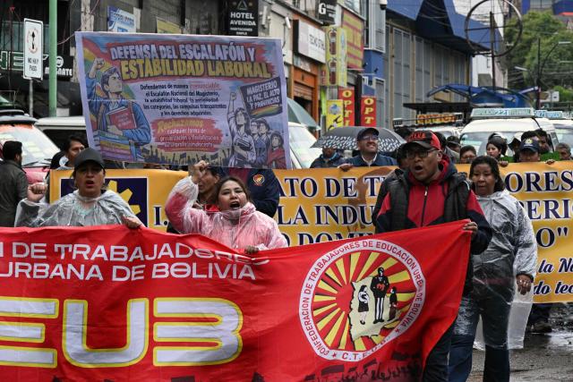 Teachers march to protest government's economic and educational policies in La Paz on October 22, 2026. (Photo by Aizar RALDES / AFP)