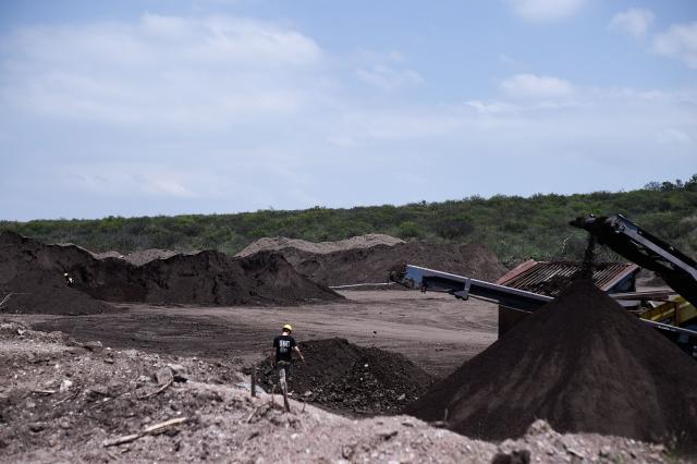 Forensic personnel from the Argentine Forensic Anthropology Team (EAAF) search for the human remains of people who disappeared during the last military dictatorship (1976–1983), at La Loma del Torito, on the La Calera military base on the outskirts of Cordoba, Argentina, on October 22, 2026, near the former clandestine detention, torture and extermination center known as "La Perla.".  (Photo by Cesar Heredia / AFP)
