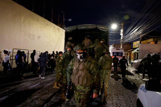 Army soldiers patrol outside the Pichincha Provisional detention centre in Quito on October 22, 2026. Eight inmates died on October 22, 2026, during riots at two prisons in Ecuador, the agency responsible for managing the country's prisons (SNAI) reported. (Photo by AFP)