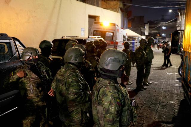Army soldiers patrol outside the Pichincha Provisional detention centre in Quito on October 22, 2026. Eight inmates died on October 22, 2026, during riots at two prisons in Ecuador, the agency responsible for managing the country's prisons (SNAI) reported. (Photo by AFP)