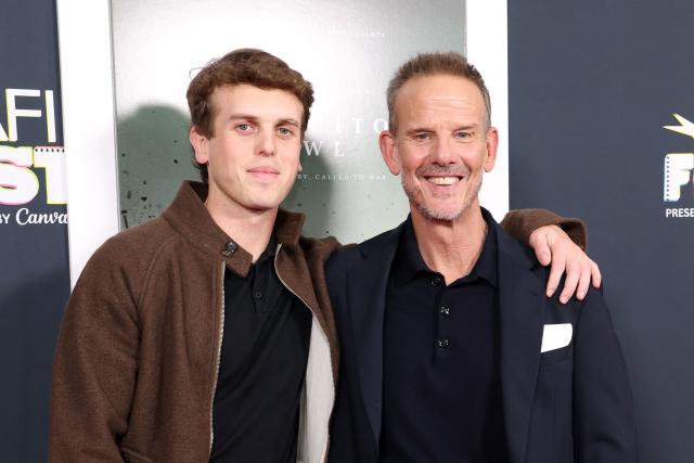US Director/producer/screenwriter Peter Berg (R) and his son Emmett Berg attend AFI FEST "The Mosquito Bowl" world premiere at the TCL Chinese Theatre in Los Angeles on October 22, 2026. AFI FEST, presented by the American Film Institute, runs from October 21 to 25, 2026. (Photo by VALERIE MACON / AFP)