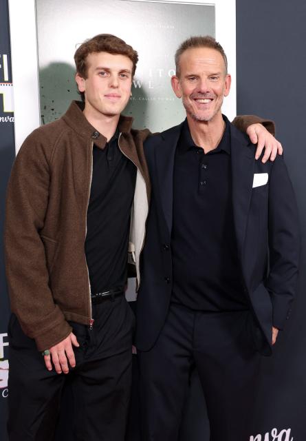 US Director/producer/screenwriter Peter Berg (R) and his son Emmett Berg attend AFI FEST "The Mosquito Bowl" world premiere at the TCL Chinese Theatre in Los Angeles on October 22, 2026. AFI FEST, presented by the American Film Institute, runs from October 21 to 25, 2026. (Photo by VALERIE MACON / AFP)